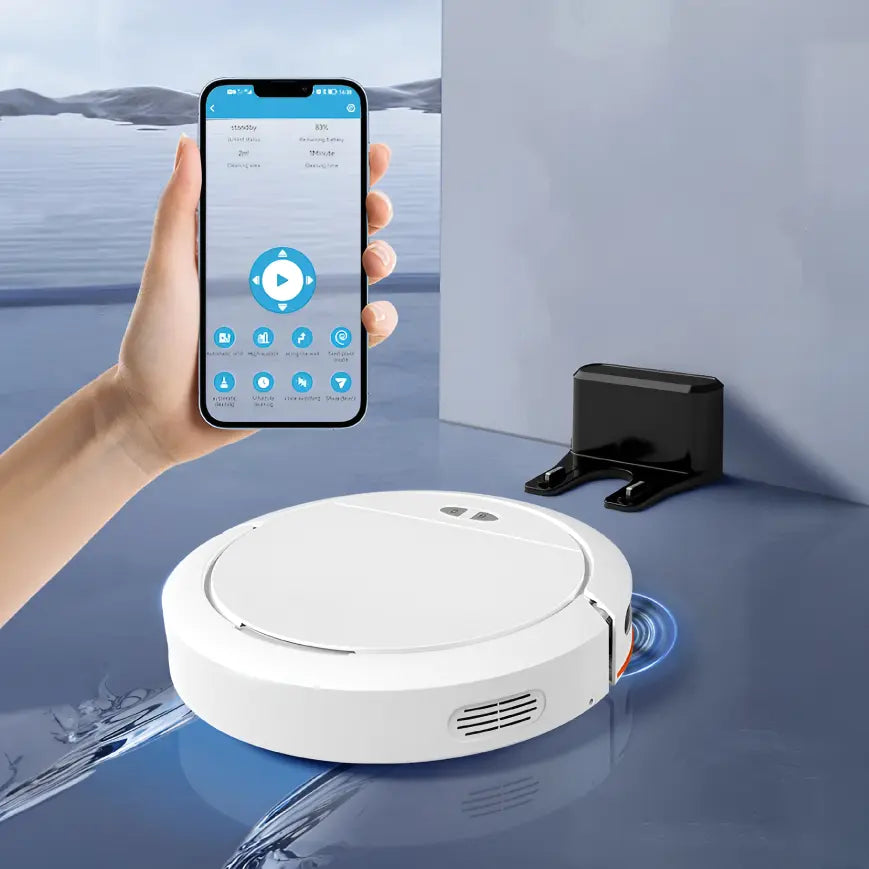Qinux Cebrot Robotic vacuum cleaner on a blue surface with a hand holding a smartphone displaying an app interface.