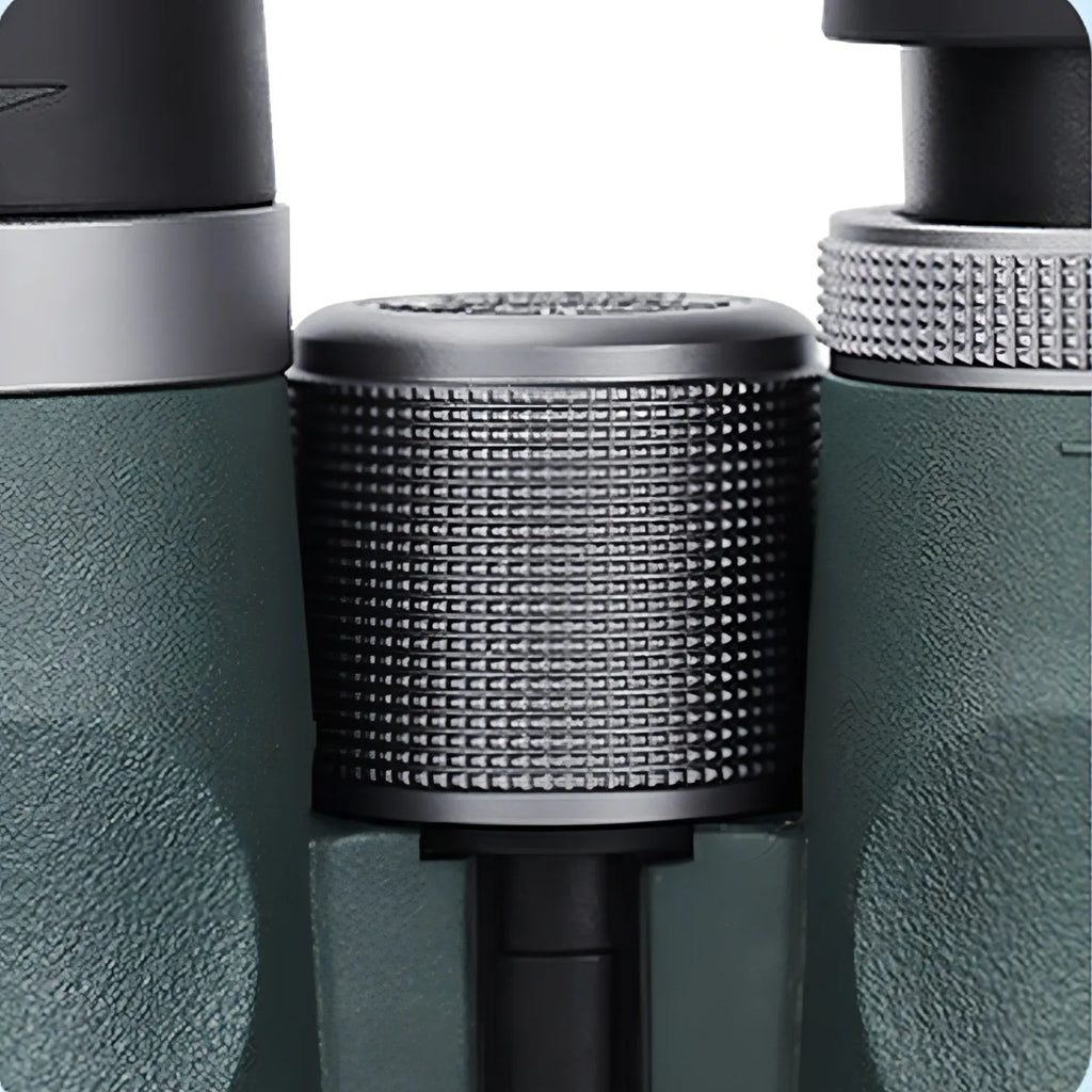 Close-up of a AuraLink Binoculars and black device with a textured cylindrical component.