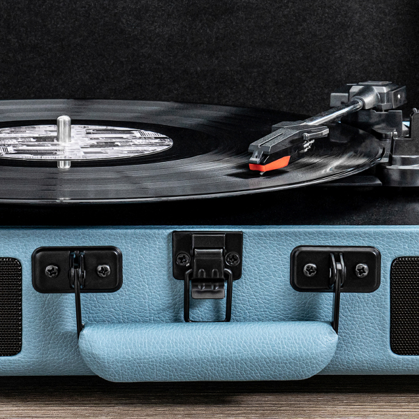 Blue Auryvox Heritage VT-80 Portable Turntable with a record on a dark background