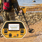 Person using a Beelines Metal Detector on a rocky beach