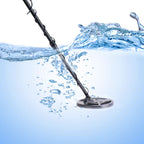 Beelines Metal Detector partially submerged in water with splashes around it.