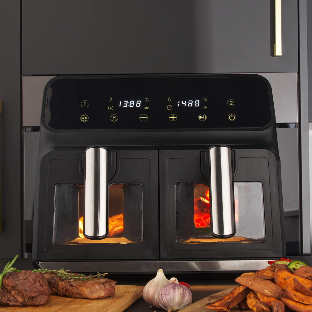 Black Plianx Air Fryer with digital display on a kitchen counter with food items.