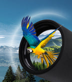 Blue and yellow parrot flying through a Bosco HD-7 Spotting Scope with a mountainous landscape in the background