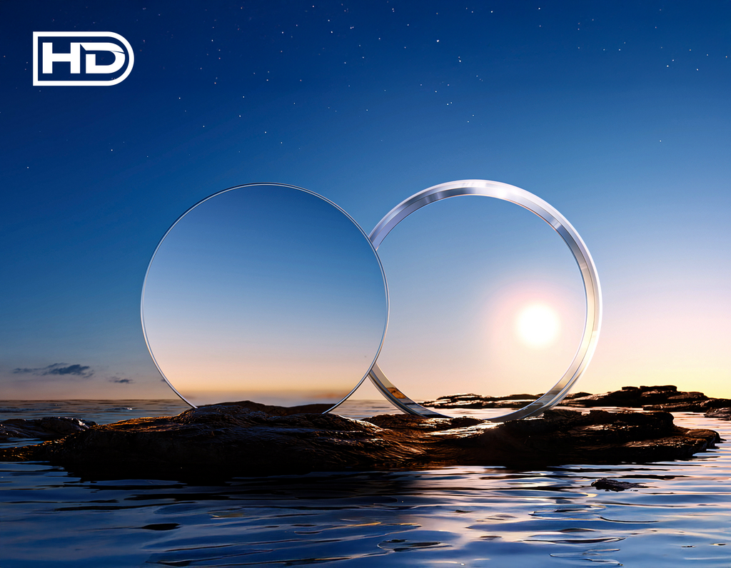 Two clear lenses on a rock with a sunset or sunrise in the background, featuring the 'HD' logo.