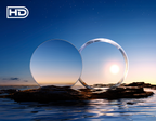 Two clear lenses on a rock with a sunset or sunrise in the background, featuring the 'HD' logo.