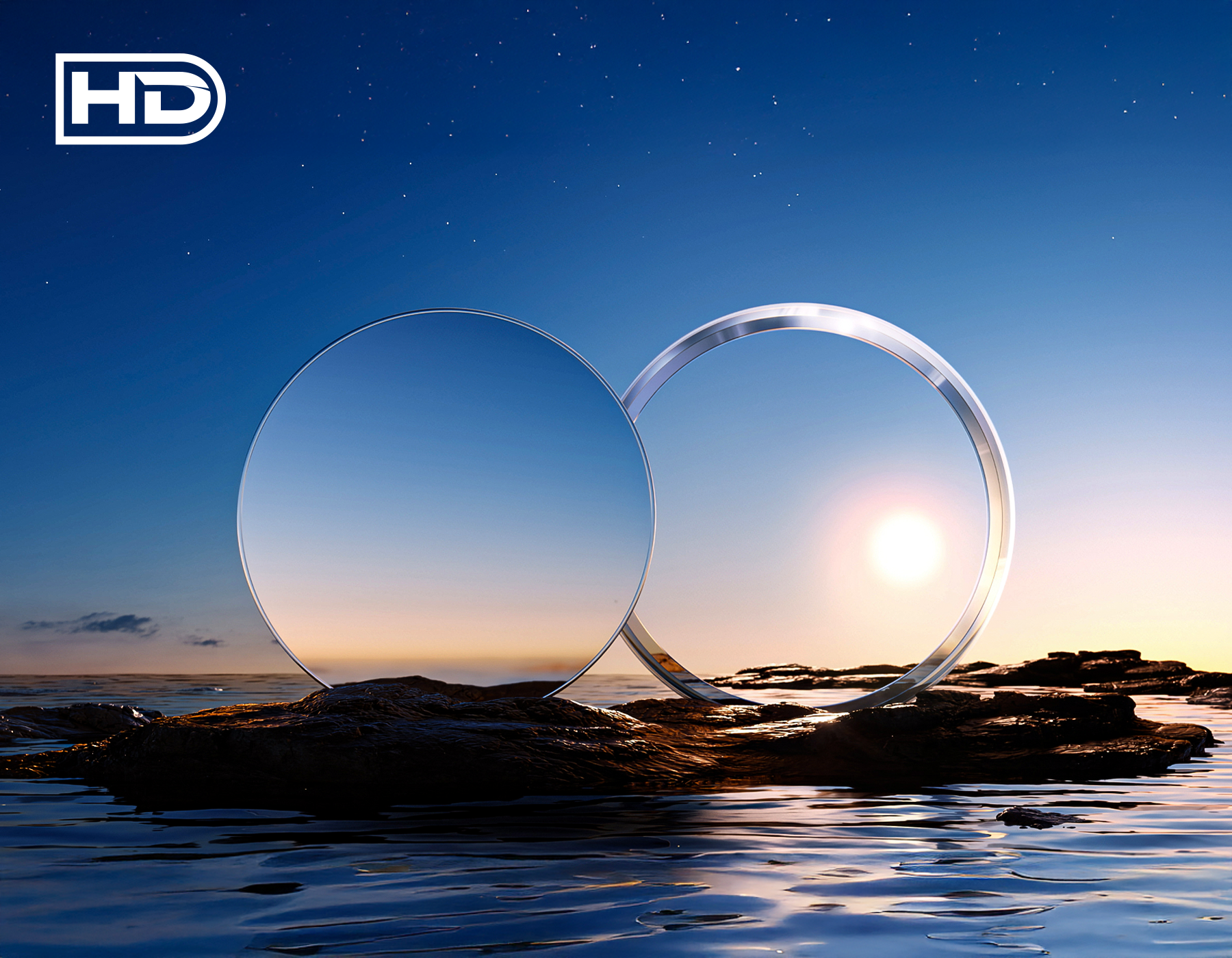Two clear lenses on a rock with a sunset or sunrise in the background, featuring the 'HD' logo.