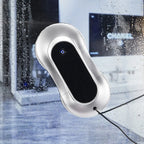 Silver window Comfylife Window Cleaning Robot on a wet glass surface with blurred background