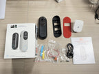 Dooric Pro Doorbell and accessories on a wooden surface