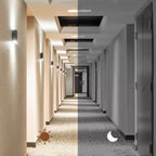 Two halves of a hallway, one lit and one dark, with a sun and moon icon.