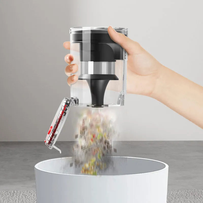 Hand using a Drexen Cordless Vacuum to sprinkle pepper into a white container on a neutral background