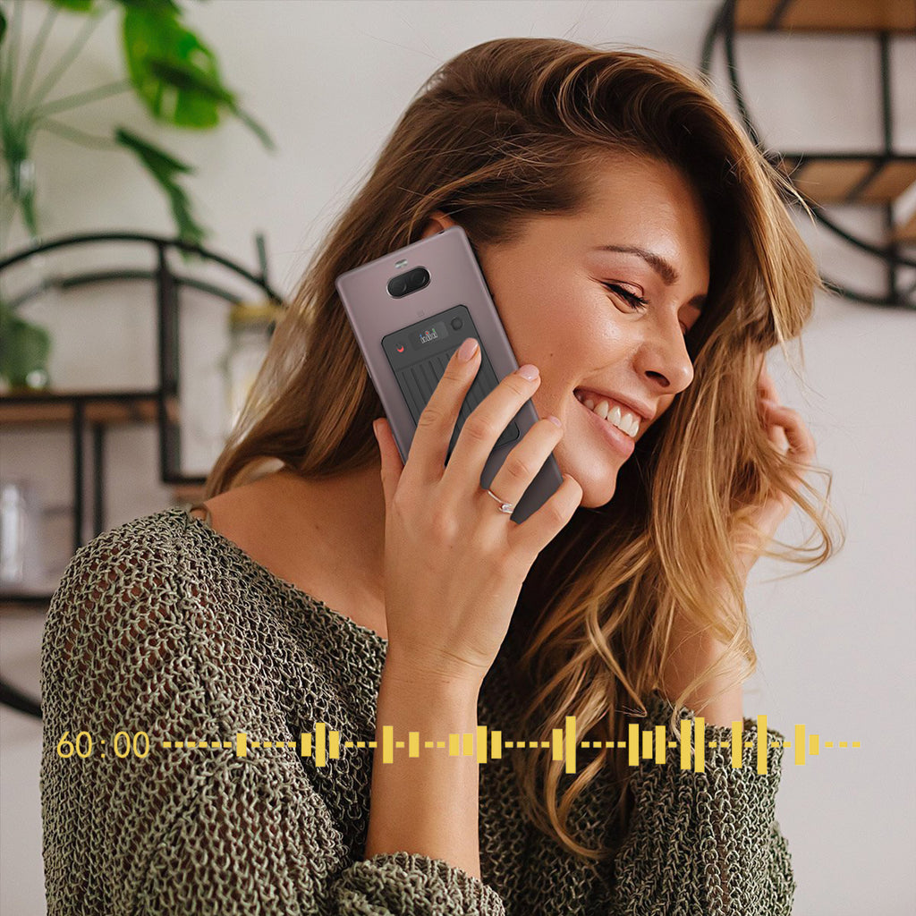 Woman talking on a phone with Fracix Al Smart Recorder a blurred background