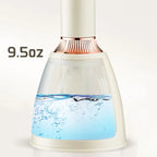 White and rose gold container with water level indicator showing 9.5 ounces on a white background.
