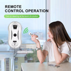 Woman using a remote control to operate a GlidePex Robot Window Cleaner device on a window, with text about remote control operation.