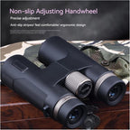 Black Huntopex Binoculars with adjusting handwheel on a wooden surface