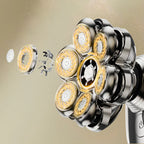 Close-up of a multi-blade Korons Head Shaver  with gold and silver blades on a beige background