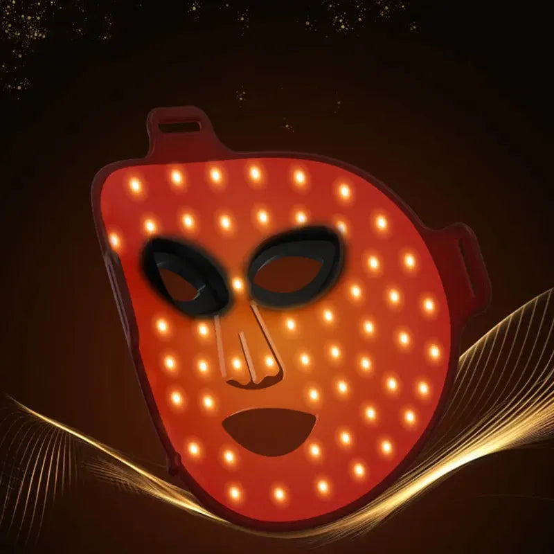 Korons LED Face Mask with glowing orange lights on a dark background