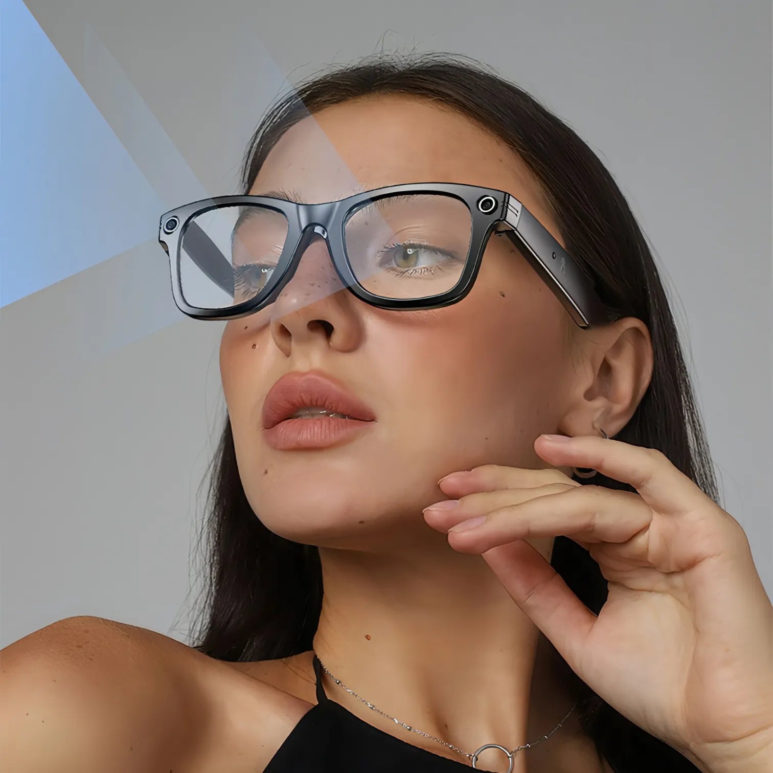 Woman wearing futuristic Korons Smart Glasses with a plain background