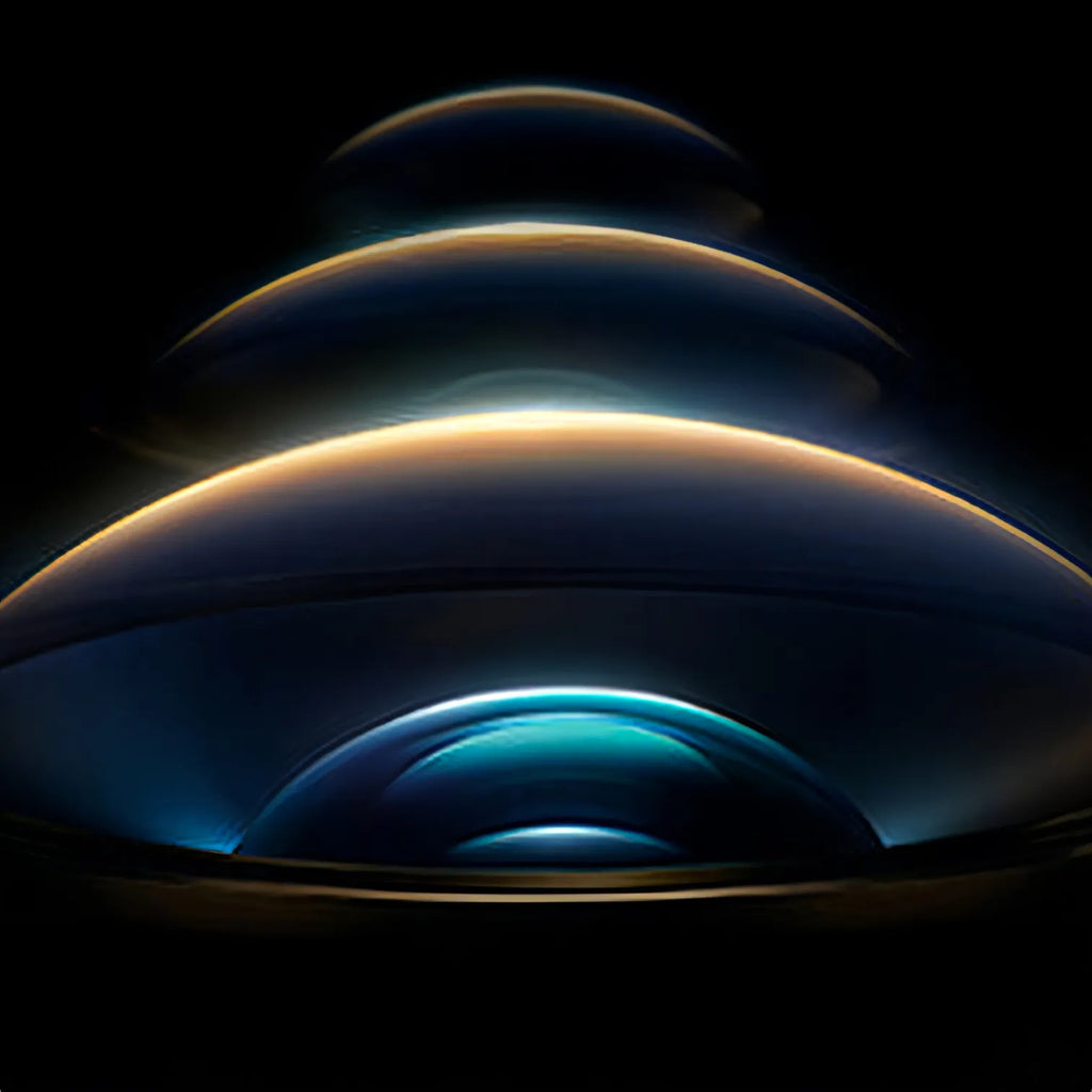 Stack of metallic cylindrical objects with reflective surfaces on a dark background