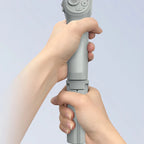 Hand holding a gray Kozenix Gimbal device against a light blue background