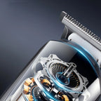 Close-up of a Kozenix Hair Clipper mechanism with metallic and blue elements on a dark background