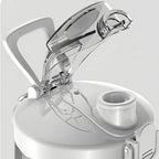 Close-up of a Kozenix Portable Blender dispenser with a clear lid on a light gray background