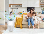 Woman and child reading on a couch with an Krona Air Purifiers in the foreground