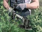 Person using a string Lawnora Cordless Grass Trimmer to cut grass and weeds