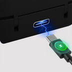 USB-C cable with green light icon being plugged into a black device with lightning symbol.