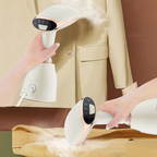 Handheld Meacode Steamer being used on a beige jacket