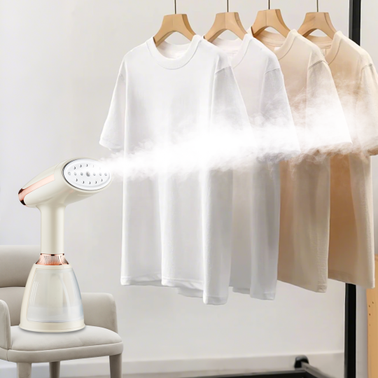 White t-shirt hanging on a rack with a Meacode Steamer next to it.