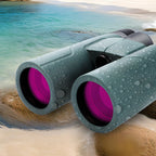 Nordzens Binoculars with pink lenses on a beach