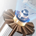 Close-up of a metallic turbine rotor with a white background