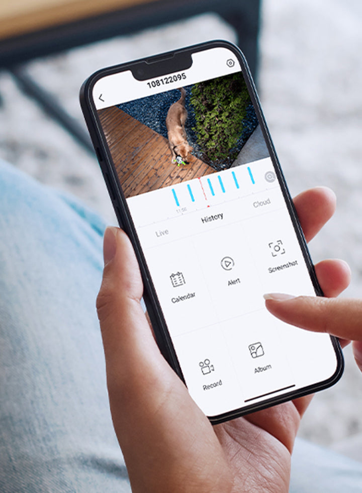 Person holding a smartphone with an app interface on the screen