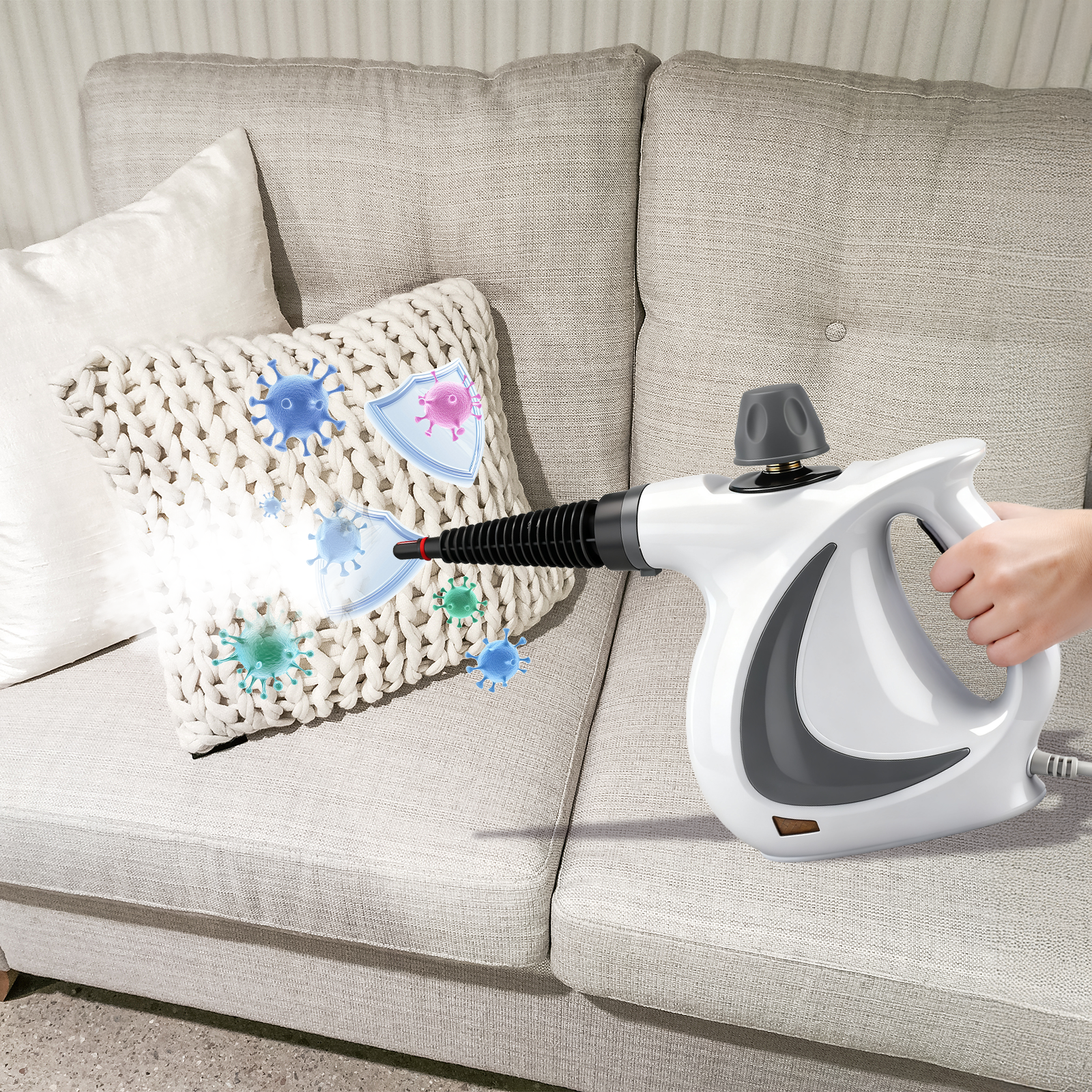 Person using a Oliventa Handheld Steam Cleaner on a pillow on a couch