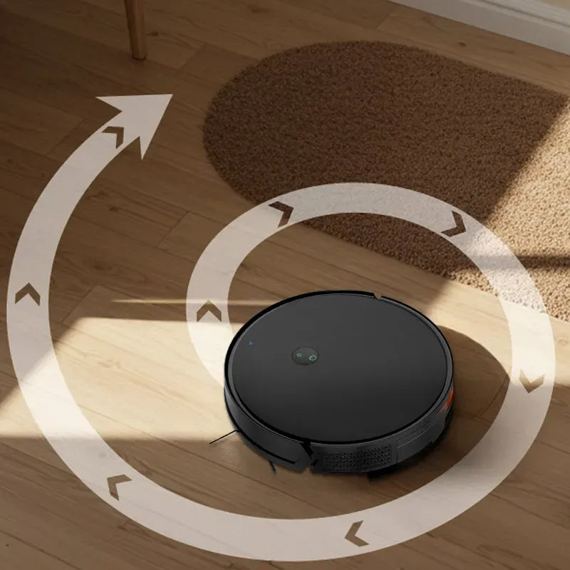 Orazum Robot Vacuum on a wooden floor with a brown rug