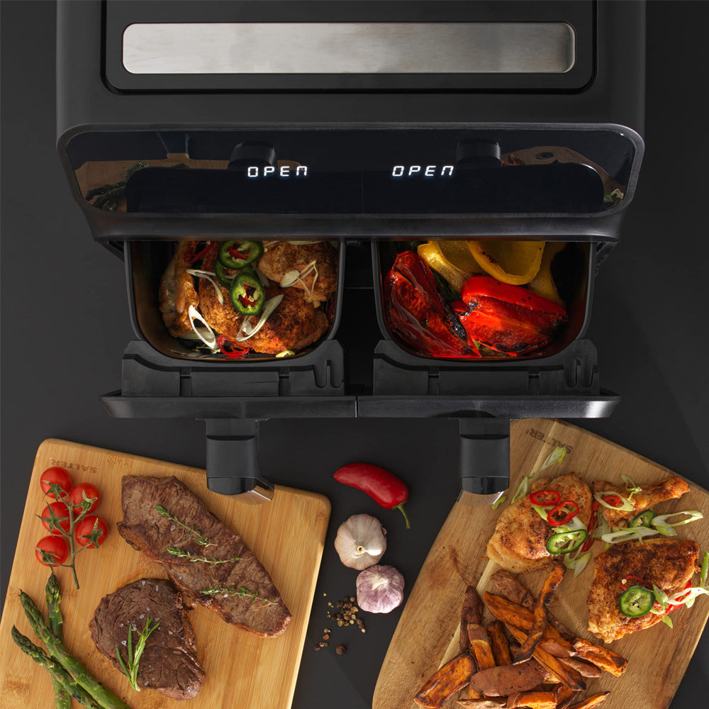 Plianx Air Fryer with food items inside, displayed on a dark background