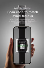 Qnixwatch being scanned by a phone with QR code on a gray background