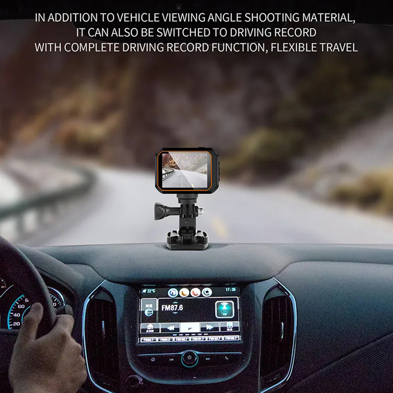 Car dashboard with a mounted ReefiSnap Action Camera and GPS display, showing a road ahead.