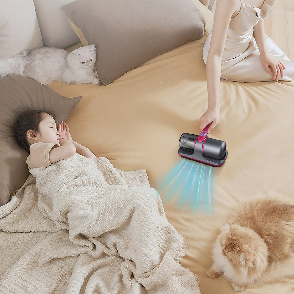 Person using a Smaven Mattress Vacuum Cleaner tool on a bed with a child and two cats.