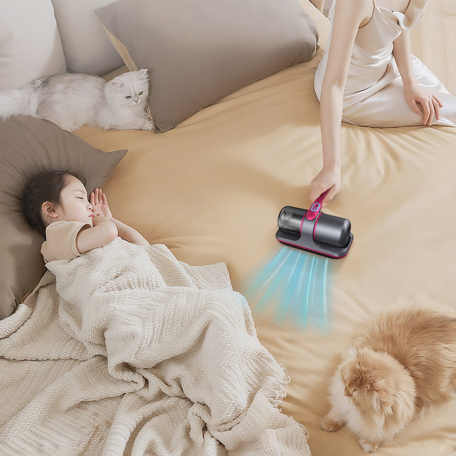 Person using a Smaven Mattress Vacuum Cleaner tool on a bed with a child and two cats.