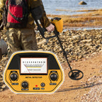 Person using a Smaven Metal Detector on a rocky beach