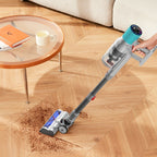 Person using a StarPod V18 Vacuum cleaner on a wooden floor in a living room.