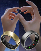 Two hands holding a gold and a silver Thurgoo Ring with digital displays on a starry night sky background.