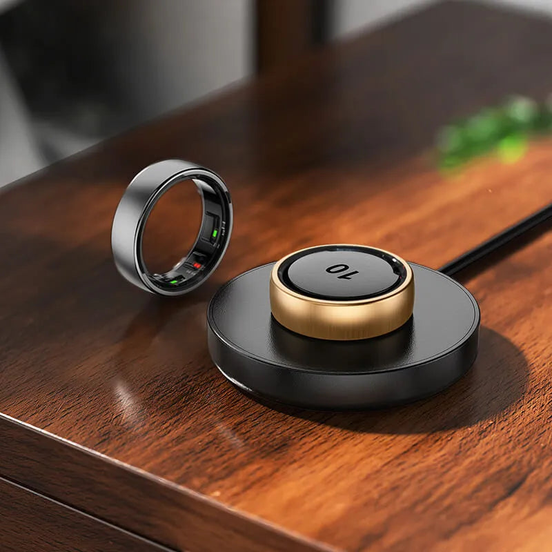 Thurgoo Smart Ring and base on a wooden surface