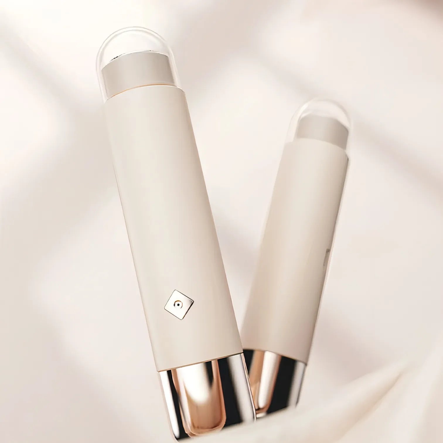 Two cream-colored beauty Trovoro Lady Shaver with rose gold accents on a light beige background