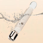 White Trovoro Lady Shaver with water splashes on a beige background