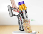 Hand holding a Vorthic Vacuum Cleaner with a clear container filled with colorful items on a white background.