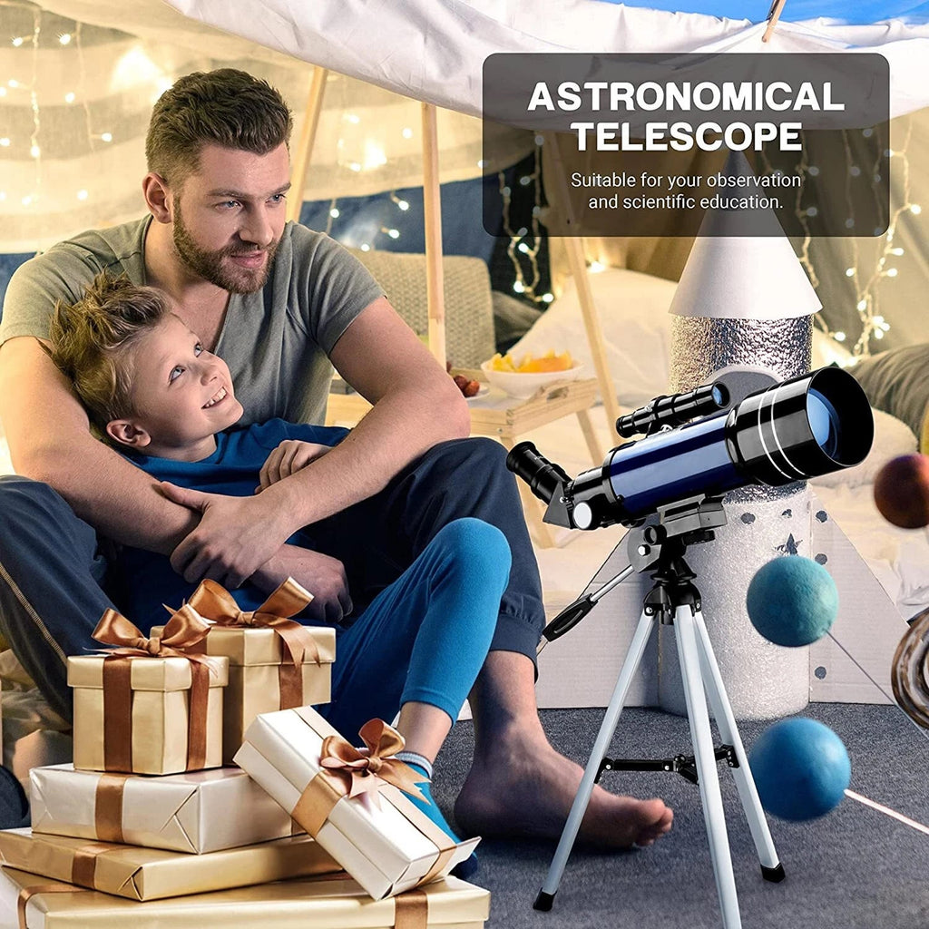Man and child sitting on the floor with a CelesView Telescope and presents in a cozy room.