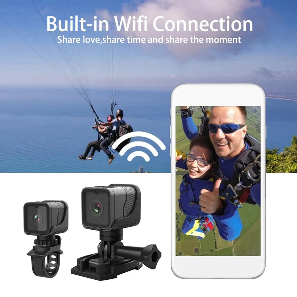Action CyKamera with built-in Wi-Fi connection, shown with a smartphone displaying a photo of two people paragliding.