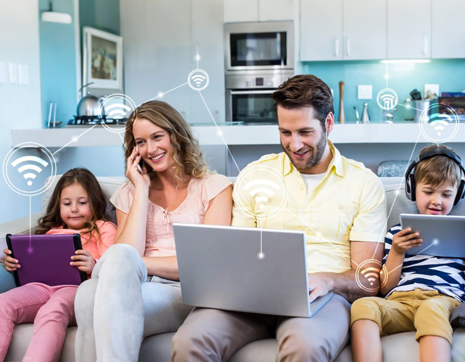family using laptop and tablets 